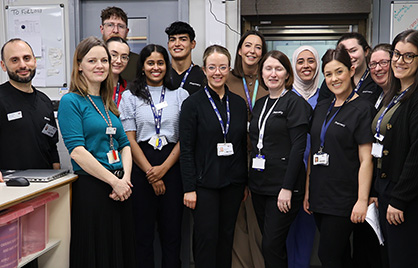 A group shot of the pharmacy team standing in the pharmacy of the Eccles Street hospital
