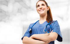 nursing-programme-238x149 A female nurse smiling with her arms crossed.