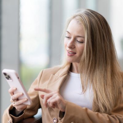 Female patient checking her phone