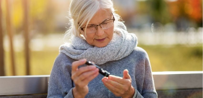 A woman checking her blood sugar levels.