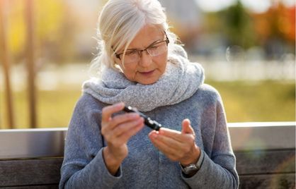 A woman checking her blood sugar levels.