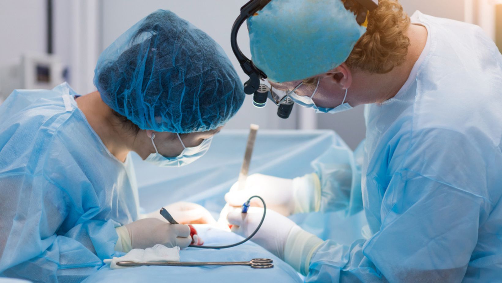 Surgeons in theatre operating
