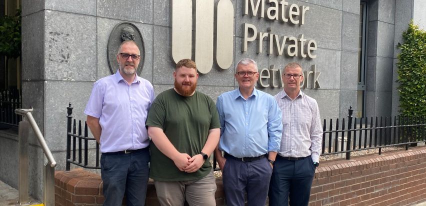 A group shot of the Stores Department - Fran Larkin, Bryan Rowe, Gerry Cummins, and Alan Fowler