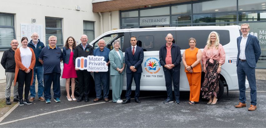 Kerry Cancer Bus 1 A group of people posing beside the Kerry Cancer Bus in front of the Mid-Western Radiation Oncology Centre in Limerick.