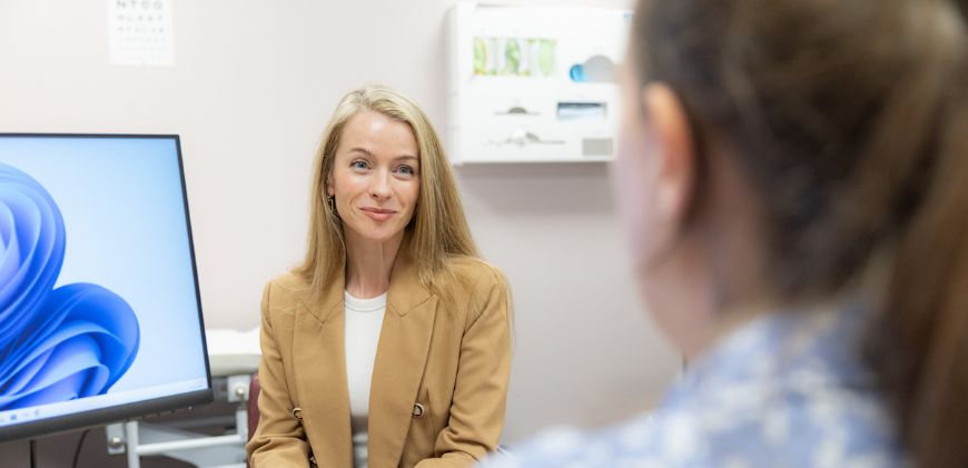 Female patient sitting in front of the doctor