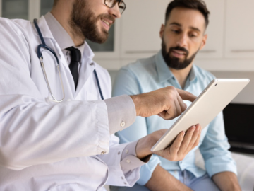 Patient and Doctor looking at health results on a tablet